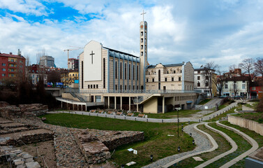 Excavations of an ancient settlement against the backdrop of the Catholic Cathedral in Sofia. Bulgaria.