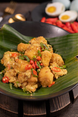 Gejrot tofu is a typical food from Cirebon, West Java, Indonesia which is made from tofu and other spices. usually served in small containers
