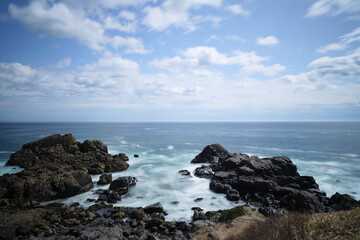 Fototapeta na wymiar Rocks and sea by long exposure