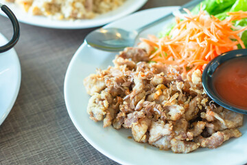 Thai food Fried Pork with Garlic and Thai peppers 