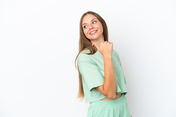 Young Lithuanian woman isolated on white background pointing to the side to present a product