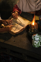 Books on the table.Hand in frame concept