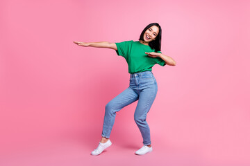 Full length photo of excited pretty person dancing make moves good mood isolated on pink color...