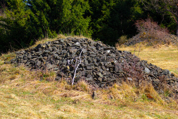 Natural mound of stones of unknown origin in mountains
