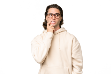 Young caucasian man isolated on green chroma background nervous and scared