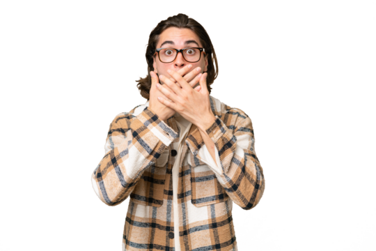 Young caucasian man isolated on green chroma background covering mouth with hands