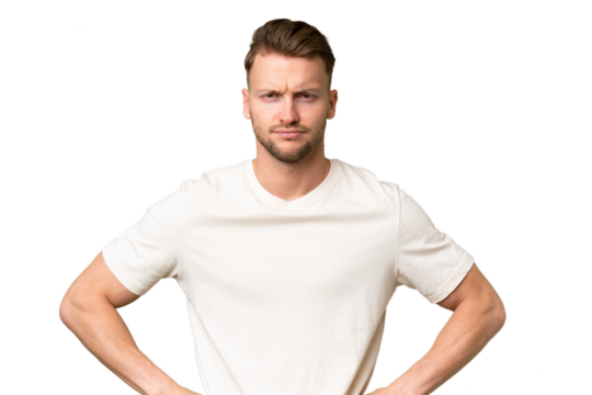 Young blonde caucasian man over isolated background angry