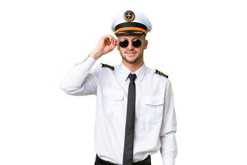 Airplane pilot man over isolated background with glasses and happy