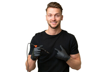 Tattoo artist caucasian man over isolated background with surprise facial expression