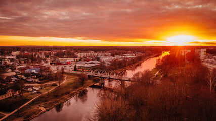 Fototapeta na wymiar bridge over a river at sunny sunset