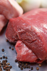 Big chunk of fresh red meat prepared for cooking in a restaurant kitchen