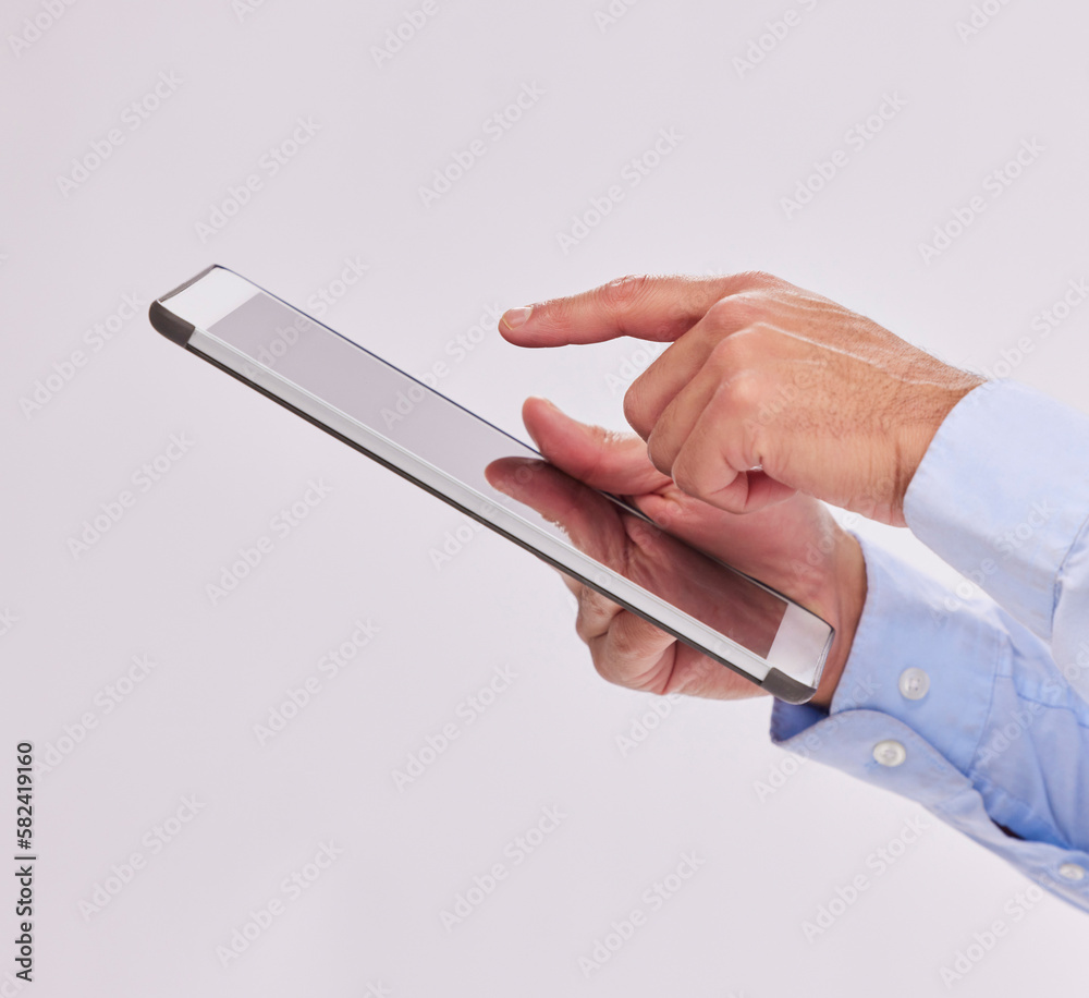 Poster Hands, tablet and business man typing in studio isolated on a white background. Technology, social media and male professional with touch screen for research, web scrolling and internet browsing.