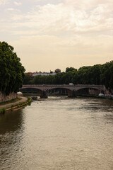 The Tiber river, the third-longest river in Italy view during evening sunset time with crossing bridge along the river stream