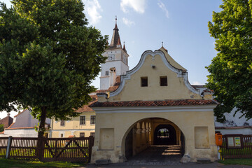 Fototapeta premium The entrance portal of the historical Church-fortress in the city of Harman. Transylvania. Romania