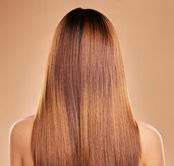 Haircare, beauty and back of woman with straight hair in studio isolated on brown background....