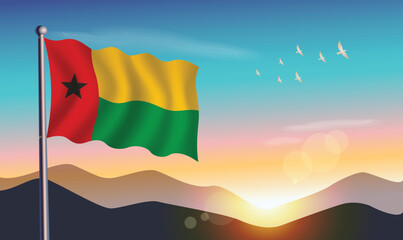 Guinea Bissau flag with mountains and morning sun in background