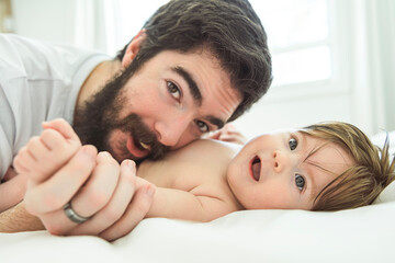 A Portrait of a beautiful father, with her nursing baby