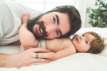 Obraz na płótnie Canvas A Portrait of a beautiful father, with her nursing baby