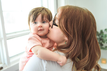 A Portrait of a beautiful mother, with her nursing baby