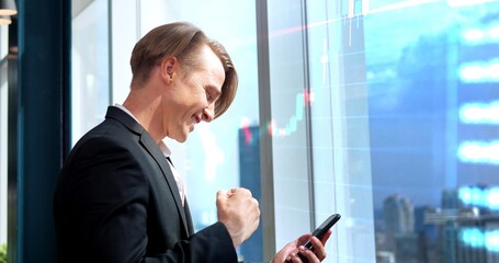 A businessman looking at Bitcoin price chart on the digital exchange on a mobile phone screen,...