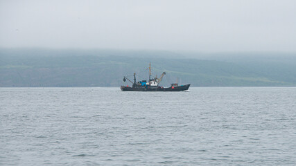 Fishing boat in Avacha Bay in Kamchatka peninsula