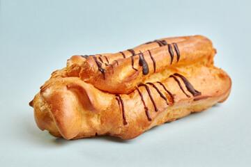 Delicious sweet cake with cream filling on a blue background.