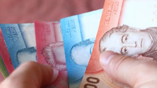 Chile pesos, Counting and putting money in hand. Currency of Chile, all banknotes