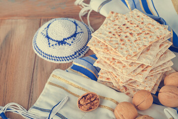 Passover celebration concept. Matzah, red kosher and walnut. Traditional ritual Jewish bread...