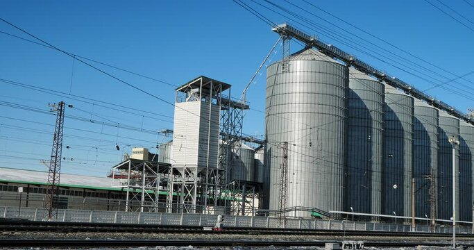 Industrial facilities. Elevator building with huge grain storage tanks. The town of Iskitim, Siberia. Hand held.
