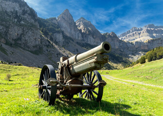 View of an old artillery piece (cannon) located in a valley in the Pyrenees mountains, on the border between Spain and France.
