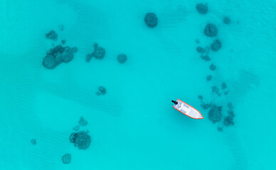 fishing in hawaii with blue water and coral.