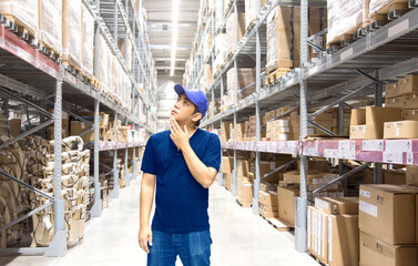 Fototapeta na wymiar Asian man finding goods on stock shelves by himself in warehouse in logistic business concept