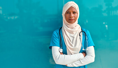 Muslim doctor outside near the hospital