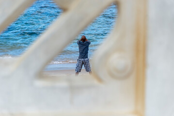  Man doing stretches on Farol da Barra beach