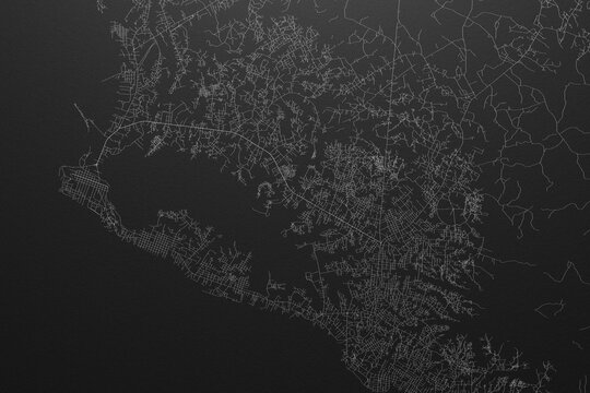Street map of Monrovia (Liberia) on black paper with light coming from top
