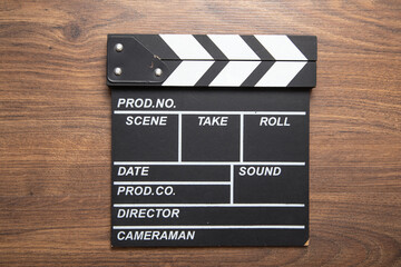 Obraz premium Movie clapper on the wooden background.