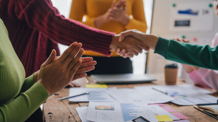 Shaking hands, Employees of the company receive auditing of accounting information. Help check...