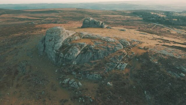 Aerial drone shot of Hay Tor rock monolith in Dartmoor National Park, Devon, UK