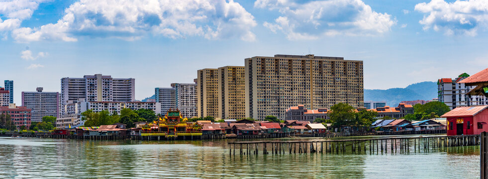 George Town, Penang, Malaysia: Overlooked by modern apartment buildings are the Clan Jetties alongside the Hean Boo Thean Temple.
