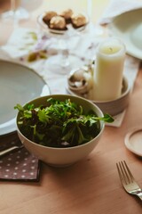 Vertical shot of the modern table setting with delicious healthy salads