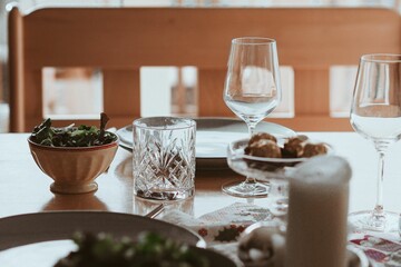 Vertical shot of the modern table setting with delicious healthy salads