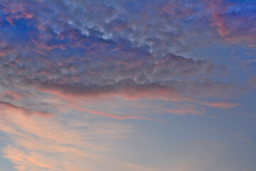 An evening sky with pink and blue clouds isolated