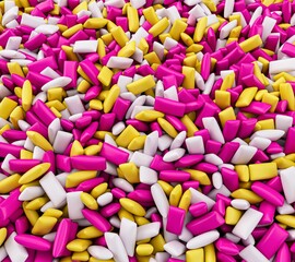 3D rendering of a background of colorful mini chewing gums