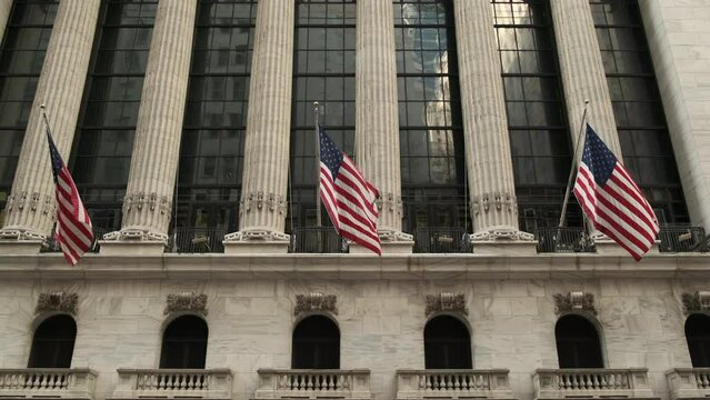 Wall street, lower Manhattan, New York City, USA. Exterior of New york Stock Exchange, largest stock exchange in world by market capitalization and most powerful global financial institute.