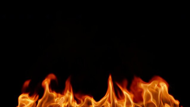 Realistic Fire Flame Isolated on Black Background. Slow-motion video of flames and fire patterns. 4K Smooth looping animation.