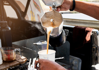 Barista making coffee with moka pot