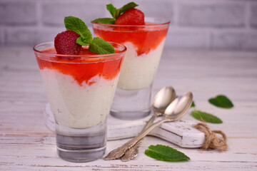 Delicate rice pudding with strawberry jam.	