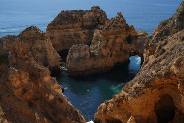 Fototapeta premium Scenic View of Praia do Camilo beach of blue water in Lagos, Portugal