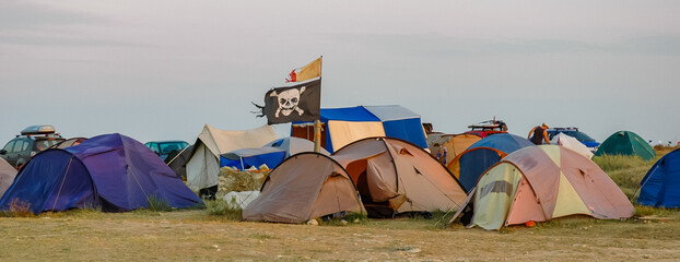KRIMEA, UKRAINE - AUGUST 10, 2008: Comic pirate flag, SKULL AND BONES, near the campground on...