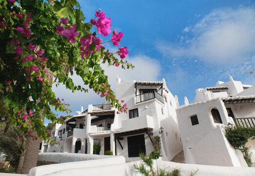 Binibeca town, Menorca island, Spain, Beautiful view of old town with flowers